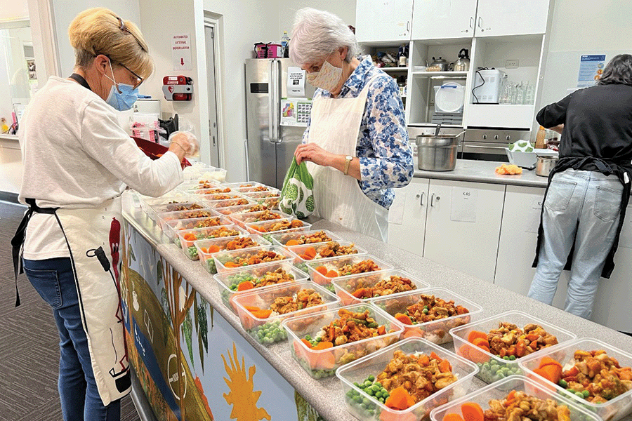 Volunteers packing meals for charity